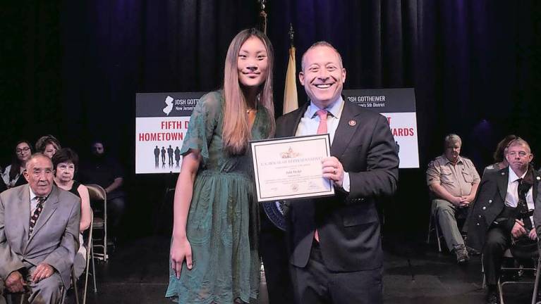 Julia Decker, a junior at Newton High School who partnered with Love Without Boundaries to raise money for children suffering from cleft palate, U.S. Congressman Josh Gottheimer (Photo provided)
