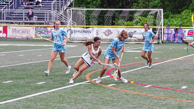 Sparta and Passaic Valley players battle for control of the ball in the first round of the NJSIAA North Jersey, Group 2 tournament May 28. (Photos by George Leroy Hunter)