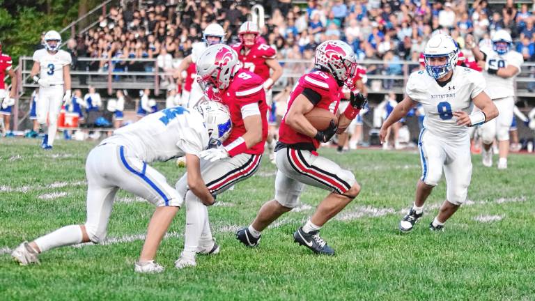 <b>High Point ball carrier Jerron Martress finds an opening in the game against Kittatinny on Friday, Sept. 12. He scored twice and rushed for 143 yards. The Wildcats won, 14-7. (Photos by George Leroy Hunter)</b>