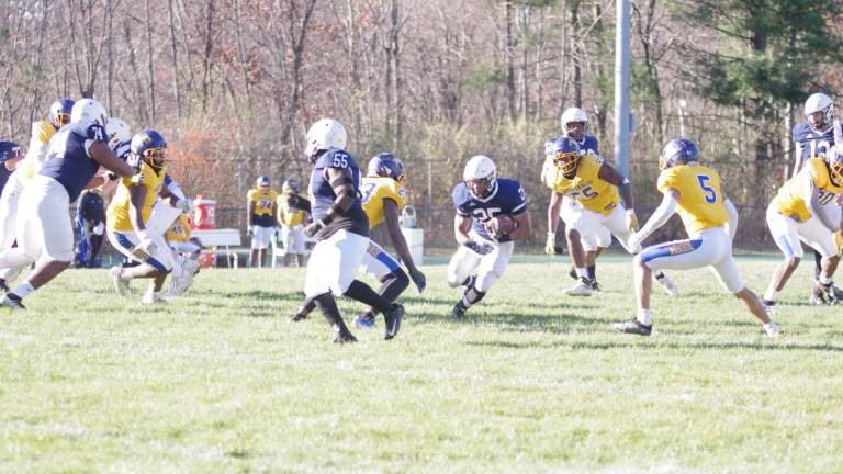 Running back Thaylor Siblies of the Sussex Skylanders carries the ball in the game against Monroe College on Saturday, Nov. 18. He made one touchdown and the team won, 47-27. (Photos by George Leroy Hunter)