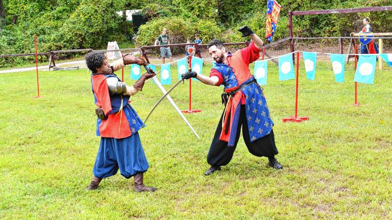 SRF1 Two knights demonstrate their sword-fighting skills Sunday, Sept. 7 at the Sparta Renaissance Festival. (Photos by Maria Kovic)