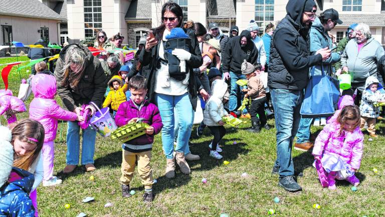 Children hunt for Easter eggs.