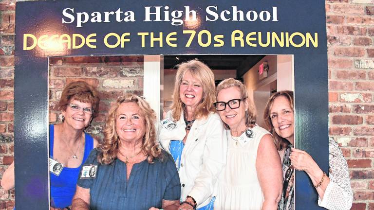 Marie Louise Johnson of Jupiter, Fla., Karen Westbrook of Stillwater, Renee Panten of Sparta, Lisa Lill of Morristown and Kathy Judge of Illinois pose inside a frame.