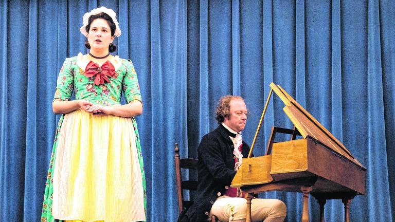 Eliza Lichack sings while Erik Lichack plays the harpsichord.