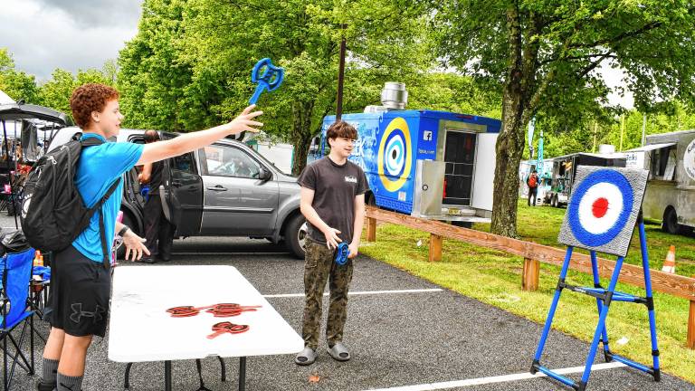 Matthieu Patterson of Sparta throws an ax at a target at Sparta Day. (Photos by Maria Kovic)