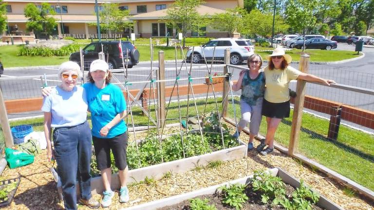 Volunteers Mary Spector, Marie Wilson, Claudia Kunath and Anita Schweizer are among the many expert gardeners who design and maintain the community gardens at Project Self-Sufficiency. (Photo provided)