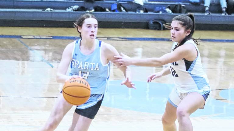 Sparta's Isabella Van Winkle dribbles the ball past West Morris Central's Alanna Vieira. Vanwinkle scored 7 points.
