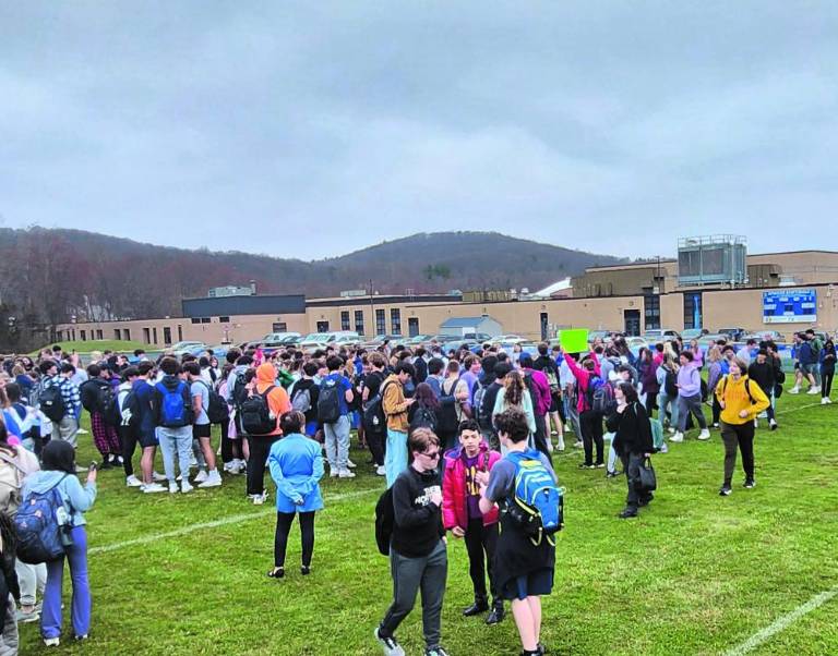 $!High school students protest gun violence with a walkout