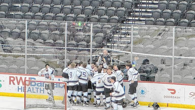 The Kinnelon/Jefferson/Sparta ice hockey team celebrates its win in the NJSIAA Public Co-Op Tournament final Monday, March 10 at the Prudential Center in Newark. (Photos by Aidan Mastandrea)