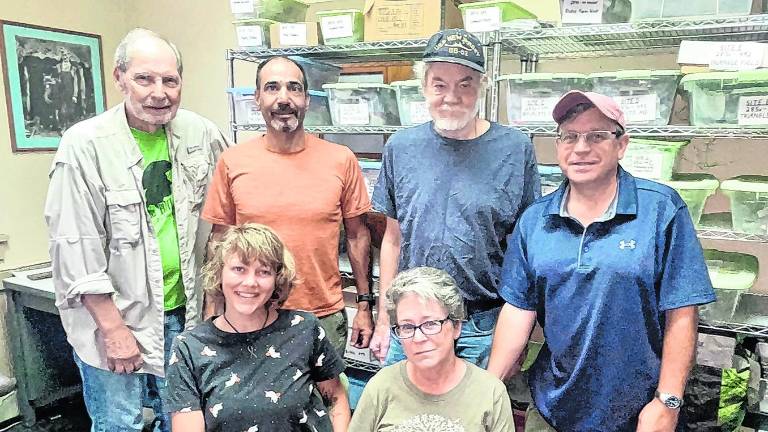 <b>The team reviewing the artifacts are standing: Jim Kotcho, Tony Lombardo, Bill Sandy and Everett Conklin; seated: Kalee McCloud and Karen Nelson.</b>