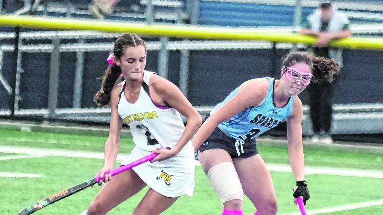 West Milford's Gianna White and Sparta's Cassie Ailara battle for control of the ball.