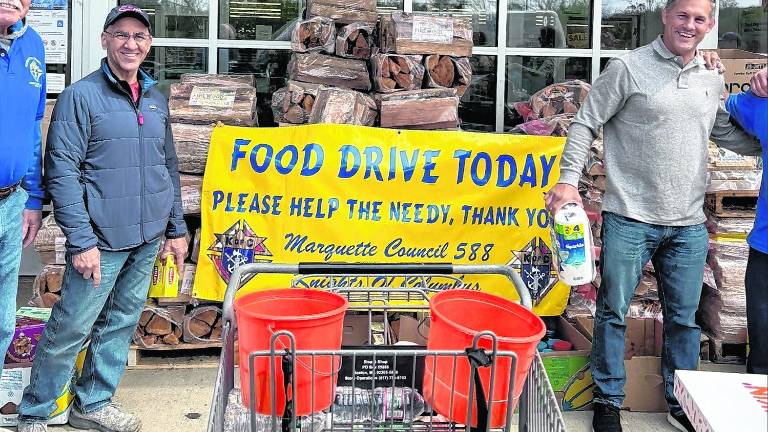 Members of the Knights of Columbus Council 588 collect food.