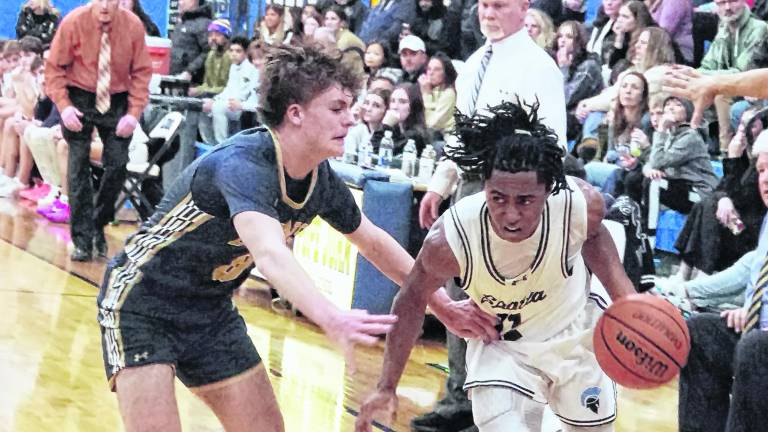 Sparta's Leshem Little handles the ball while covered by Pope John's Tyler Rossi. Little scored 23 points.