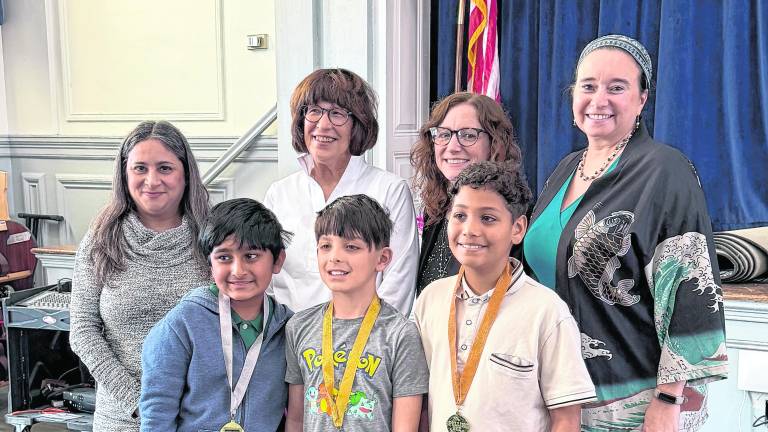 From left, back, Lenore Davis, Maureen Dugan, Kelly Kiff, Andrea Diamond; front, Rohan Sharma, Lucas Jaffe, and Matthew Herasme.