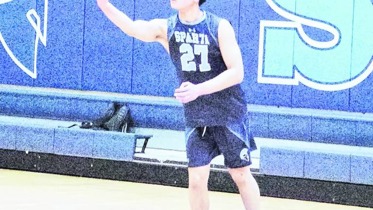 Sparta's Joshua Tolentino is about to serve. Tolentino had 9 kills, 3 digs and 1 ace.