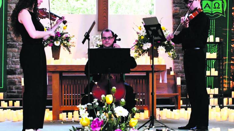 From left, Lucy Voin, Tom Valdez and Nick Pauly perform.