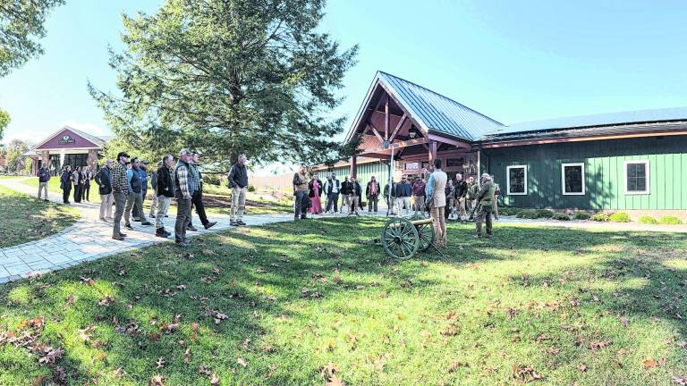 <b>Stephen Mellett and Charles A. DeAngelis from Vericon Construction welcome attendees before the ceremonial cannon fire.</b>