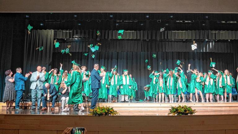 Sussex County Technical School graduates toss their caps at the end of graduation Wednesday, June 18. (Photos by Nancy Madacsi)