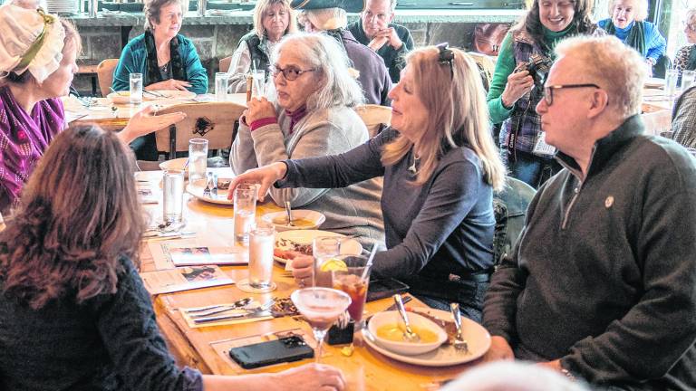 Attendees talk to Vivian Davis.